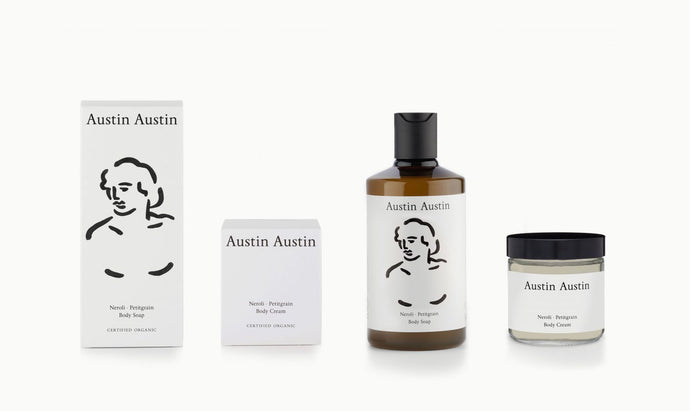 artist designed packaging head illustration Austin Austin certified organic body care duo, made with betaine to soothe, moisturise & protect. Top notes of orange & grapefruit. Middle notes of neroli & cardamom. Base notes of petitgrain & cedar wood.