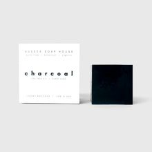 Load image into Gallery viewer, sussex soap house cube clay Formulated with Dorset charcoal, a soothing antibacterial blend of herbal essential oils such as tea tree &amp; rosemary with nourishing cocoa butter, this charcoal bar gently exfoliates, drawing &amp; absorbing impurities from the skin for a deep &amp; natural cleanse
